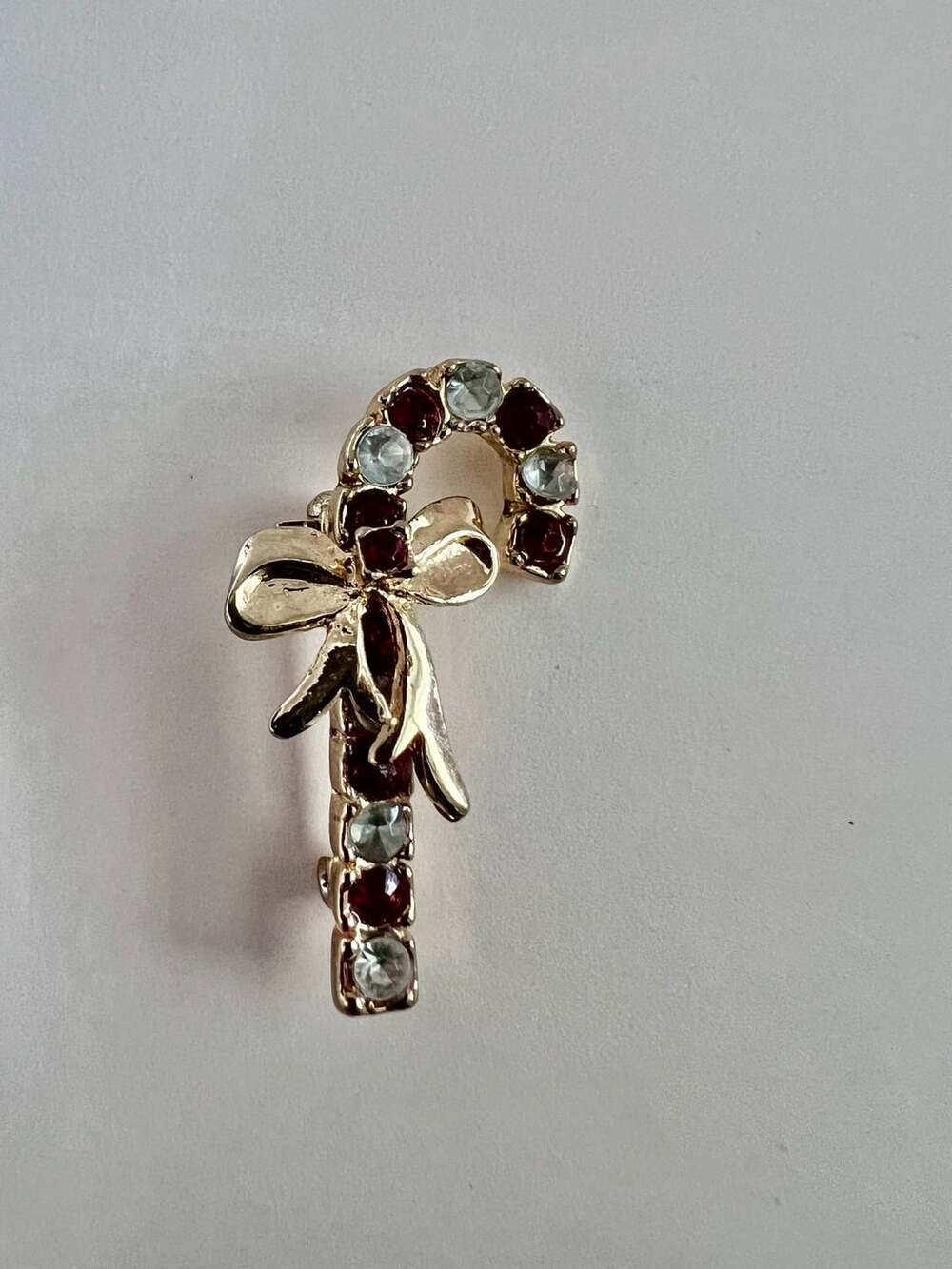 Gold Tone Rhinestone Candy Cane Brooch With Bow
